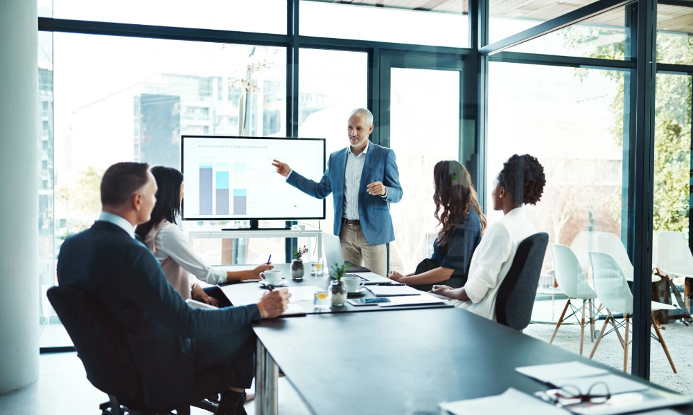 Businessman presenting in front of his colleagues